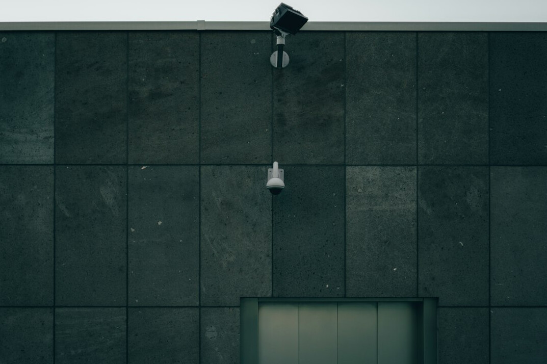 store detective watching surveillance